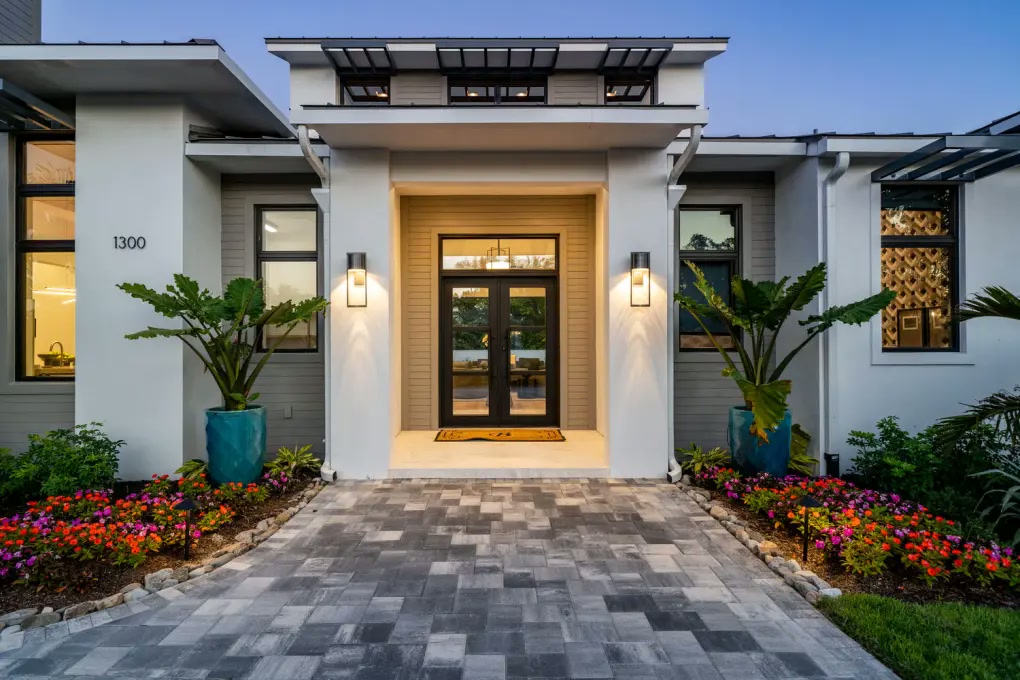 Modern front entry illuminated at blue hour